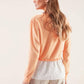 Maglia in cotone con balza ricamata