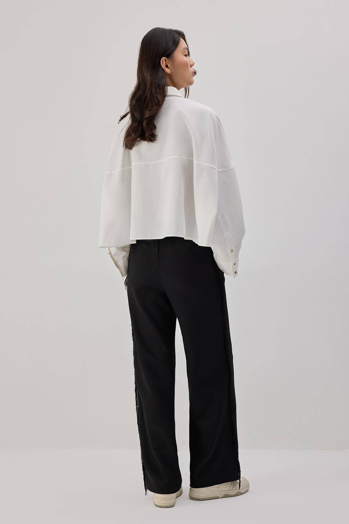 Pantaloni in crêpe con frange