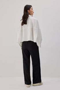 Pantaloni in crêpe con frange