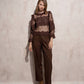 Blusa in pizzo trasparente con collo alto e maniche lunghe