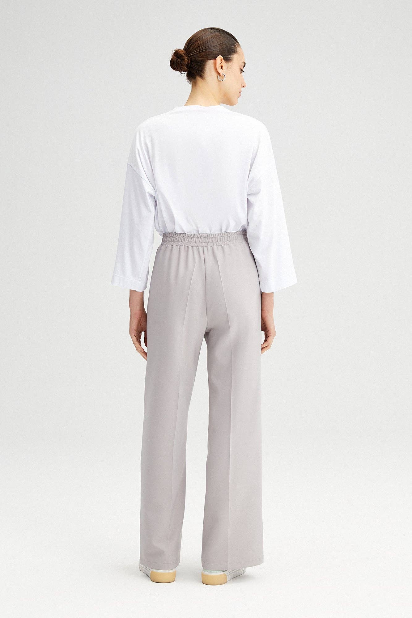 Pantaloni a vita alta in crepe elasticizzato a gamba larga