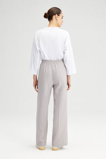 Pantaloni a vita alta in crepe elasticizzato a gamba larga