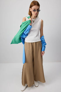 Pantaloni palazzo in cotone con bordi sfrangiati