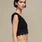 Top crop in maglia a costine con bordo ondulato