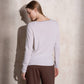 Maglione in maglia scintillante con profilo ondulato