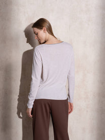Maglione in maglia scintillante con profilo ondulato