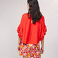 Blusa fluida con maniche a volant plissé