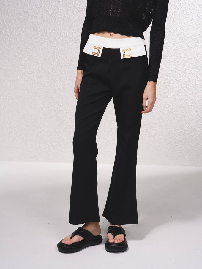 Pantaloni svasati bicolore a vita alta con dettagli gioiello