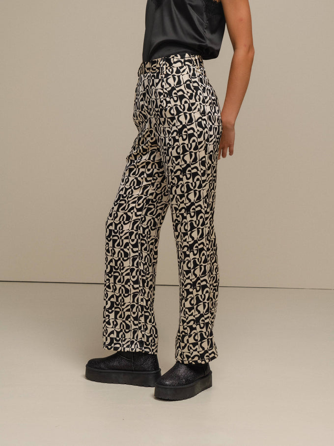 Pantaloni a fantasia geometriche effetto perlato