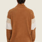 Maglione in pile marrone bicolor con collo alto