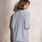 Completo in maglia scintillante due pezzi con gonna midi
