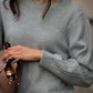 Maglia con maniche traforate e scollo tondo