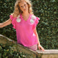 T-shirt con applicazioni floreali e maniche a volant