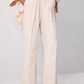 Completo donna camicia testurizzata con cintura e pantaloni palazzo