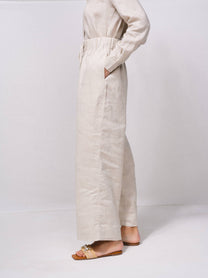 Pantaloni larghi in lino con vita elasticizzata e coulisse