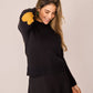 Maglione nero con toppe a cuore e bottoni sul retro