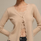 Cardigan donna in maglia con scollo a V e bordo ondulato