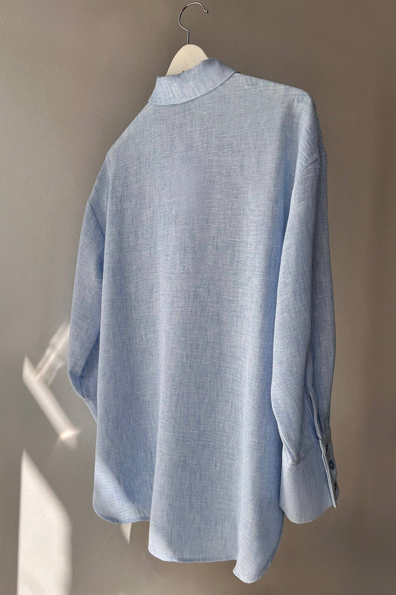Tunica melange azzurro chiaro con colletto a camicia