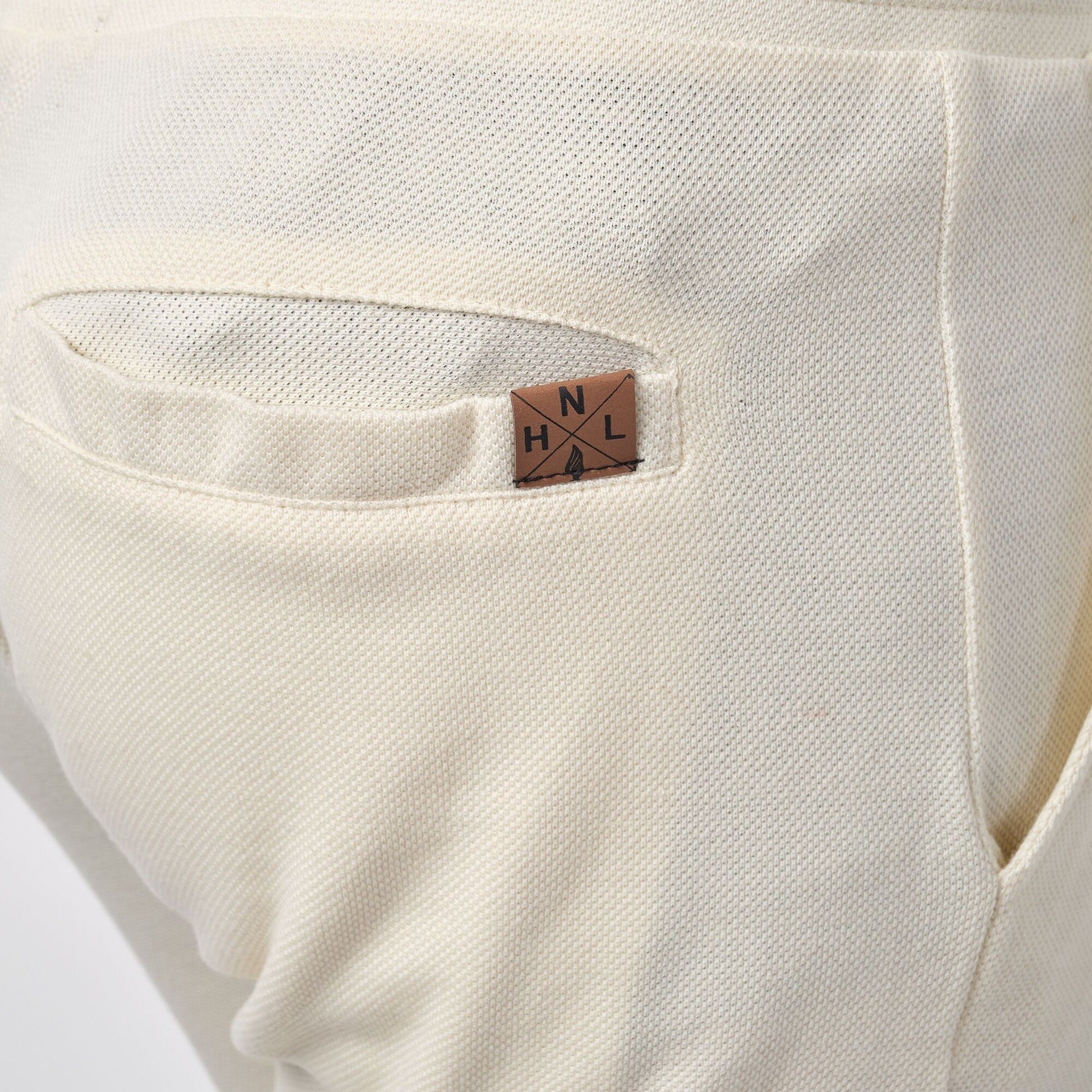 Pantaloncini bermuda in piqué ecrù da uomo