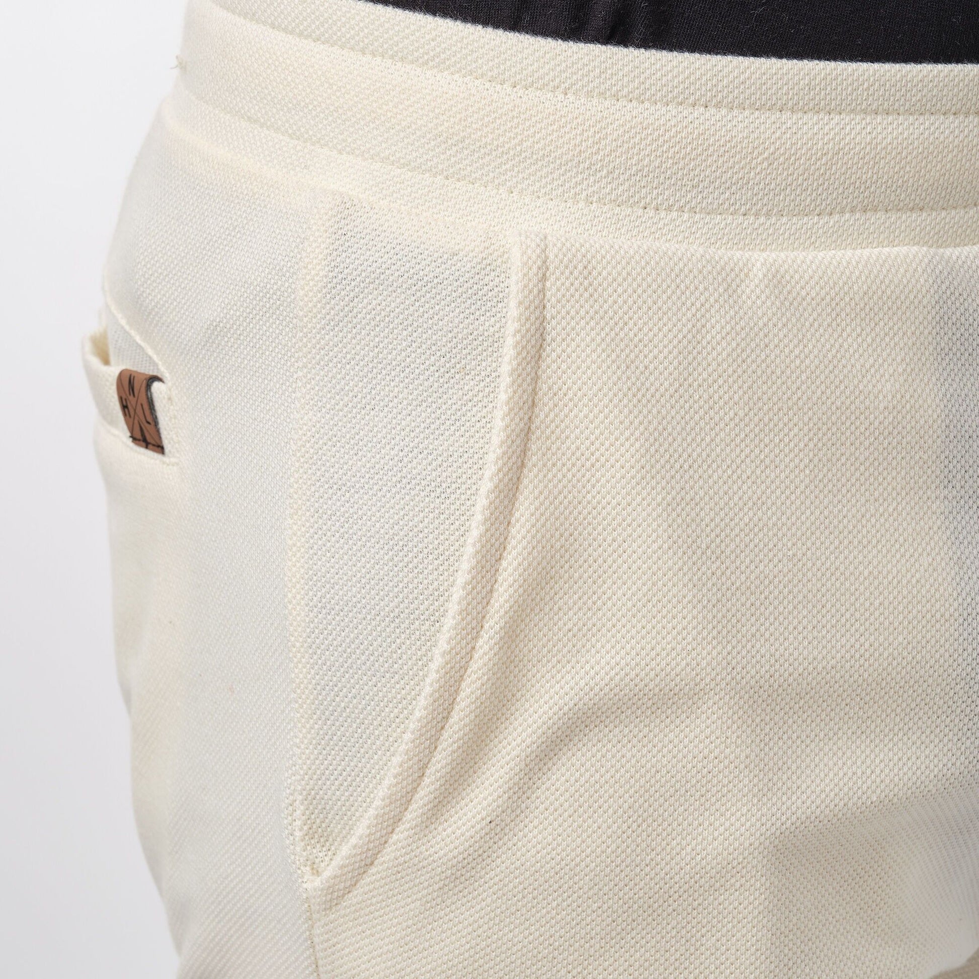 Pantaloncini bermuda in piqué ecrù da uomo