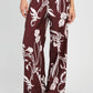 Pantaloni a palazzo bordeaux con stampa floreale