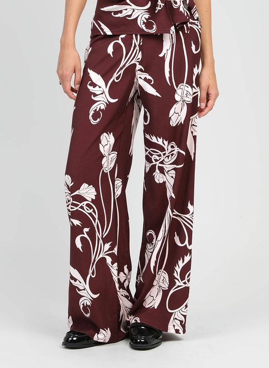Pantaloni a palazzo bordeaux con stampa floreale