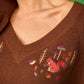 Maglione con scollo a V ricamato beige