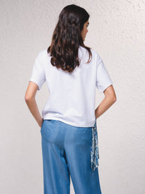 T-shirt oversize corta con stampa e fiocco laterale