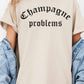 T-shirt oversize grafica “Champagne Problems”