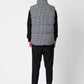 Gilet imbottito pied de poule con cappuccio staccabile