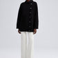 Maglione nero oversize con bottoni asimmetrici