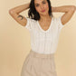 Top in maglia traforata con scollo a V Maki