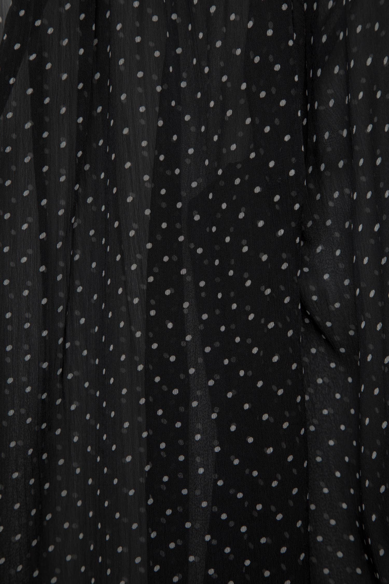 Blusa a pois semitrasparente con scollo a V