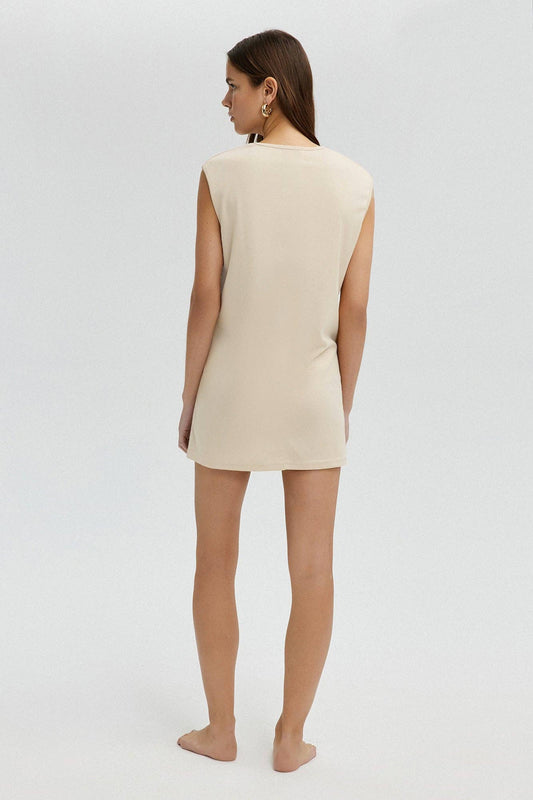 Tunica lunga minimalista senza maniche color crema