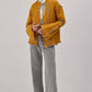 Cardigan in maglia senape con cintura a contrasto