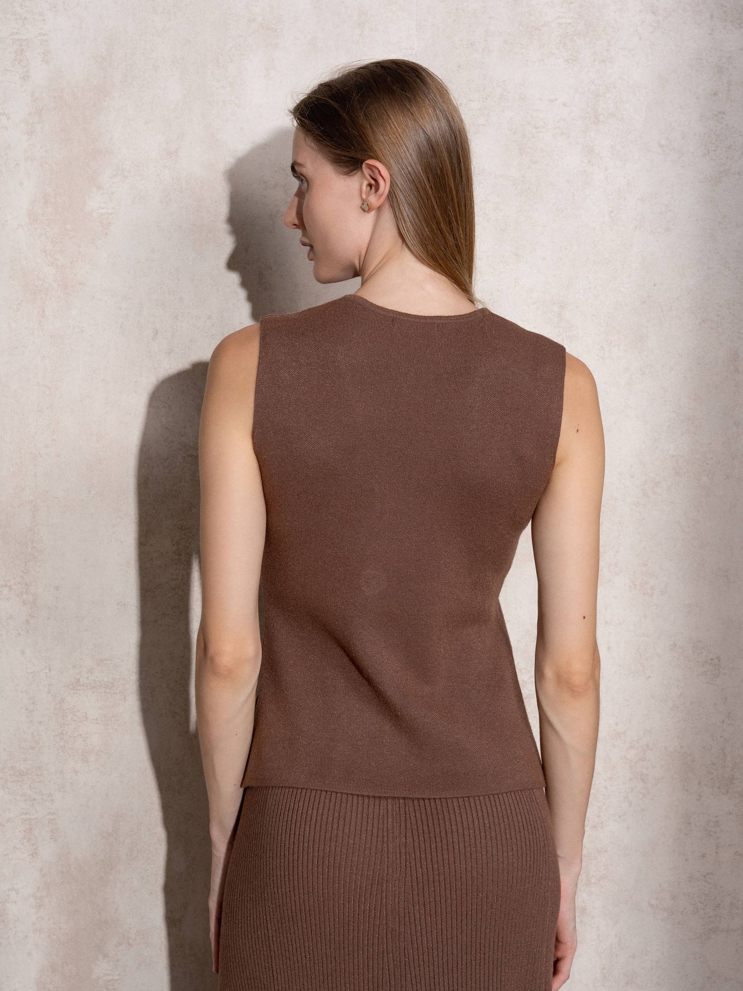 Gilet in maglia con bottoni dorati