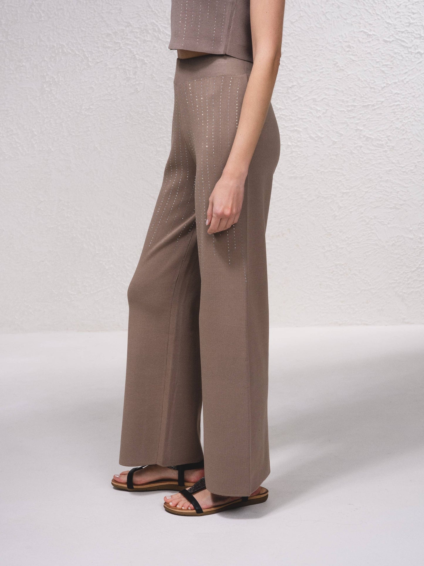 Pantaloni in maglia a gamba ampia con applicazioni glitter