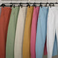 Pantaloni in twill con spille decorative