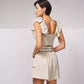 Top crop aderente con volant
