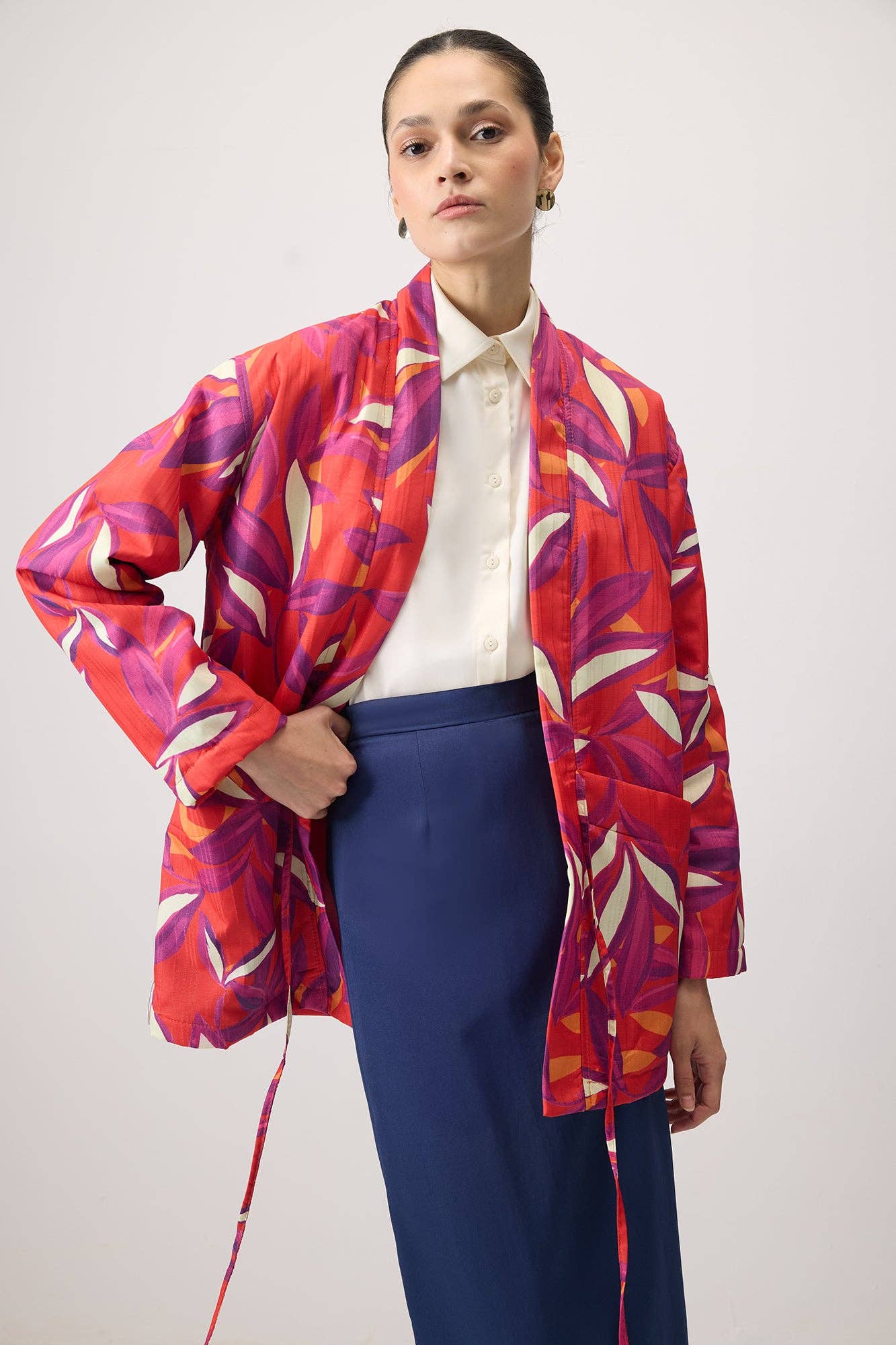 Cappotto fantasia con nodo frontale