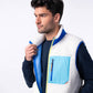 Gilet sherpa unisex avorio e blu con zip