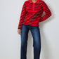 Maglione a righe con collo polo