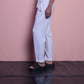 Pantaloni a vita alta color perla con bottoni dorati