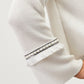 Maglia in cotone con maniche a campana e frange