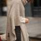 Poncho in maglia con collo alto