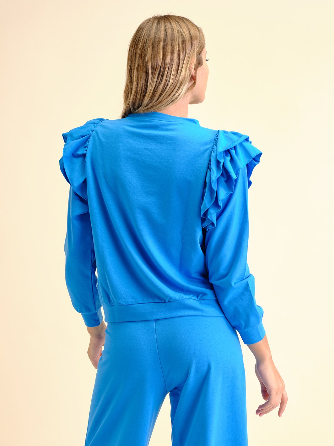 Felpa con volant e strass a fiore
