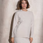 Completo in maglia scintillante due pezzi con gonna midi