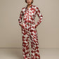 Pantaloni a palazzo con stampa geometrica color ruggine