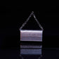 Mini borsa clutch metallizzata con manico a catena
