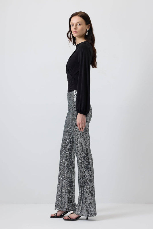 Pantaloni a zampa con paillettes